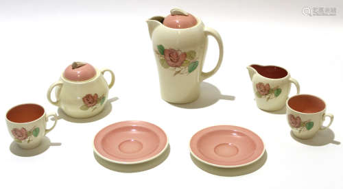 Group of Susie Cooper wares comprising a coffee pot and cover, sugar bowl and milk jug, 2 cups and