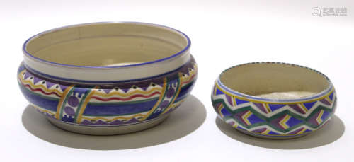 Two Poole Pottery bowls both with a geometric design, probably by Truda Carter, largest bowl 23cm