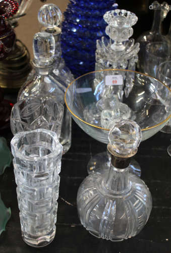 Group of cut glass wares including four decanters, a glass tazza with gilt rim and two glass vases