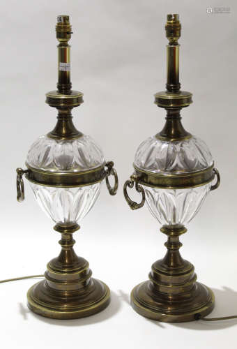 Pair of Regency style brass lamps with glass reservoirs and loop handles, 82cm high