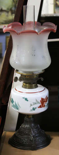 Late 19th century glass oil lamp, the white reservoir with floral design, the shade with floral