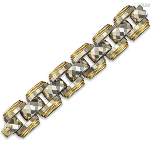 A gold tank track bracelet