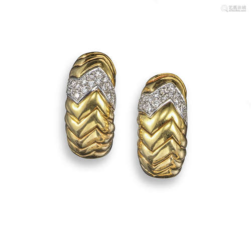 A pair of gold and diamond earrings