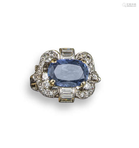 A colour-change sapphire and diamond scroll ring
