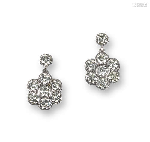 A pair of diamond cluster drop earrings