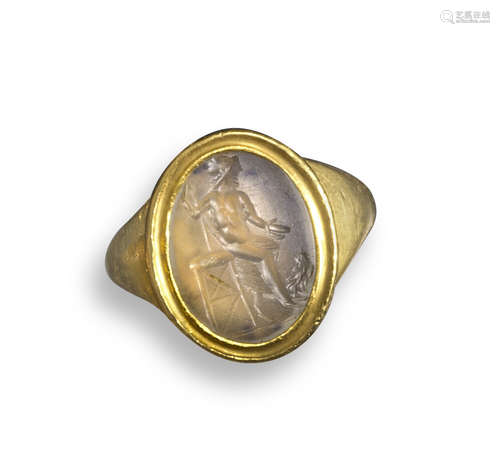 A chalcedony intaglio depicting a seated Zeus