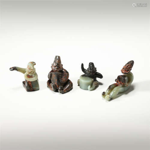 FOUR CHINESE ANCIENT JADE SEATED FIGURES