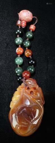 A Chinese Agate Pendant with Beaded String