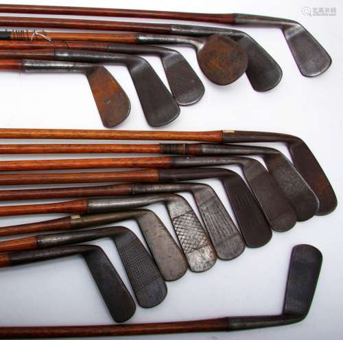 An interesteing group of antique wooden shafted putters and irons
