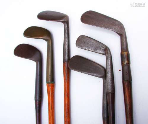 An assortment of six 19th century unusual wooden shafted irons