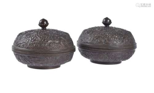 A pair of Sino-Tibetan bronze repoussé boxes and covers