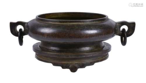 A Chinese two-handled bronze censer and stand
