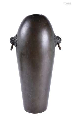 A Chinese inscribed bronze twin handled vase