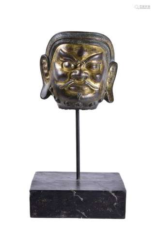 A Chinese gilt bronze head of a guardian king