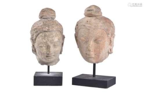 Two stucco heads of Buddha