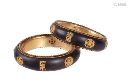 A pair of Chinese inlaid wood bangles