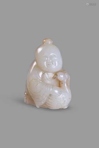 A white and russet jade group of a boy and goose