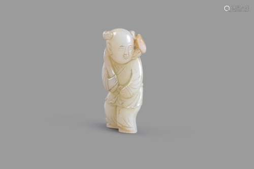 A white and russet jade carving of a boy