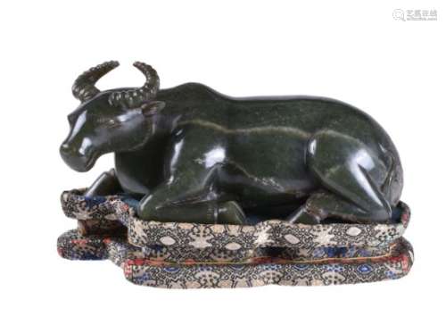 A Chinese spinach green jade carving of a buffalo