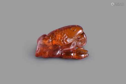 A Chinese amber 'Goldfish' pendant