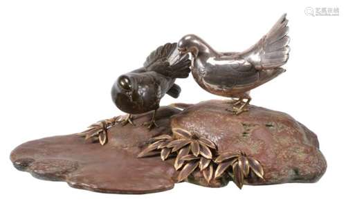 A Japanese Group of Two Fantail Doves on a rocky outcrop by a stream