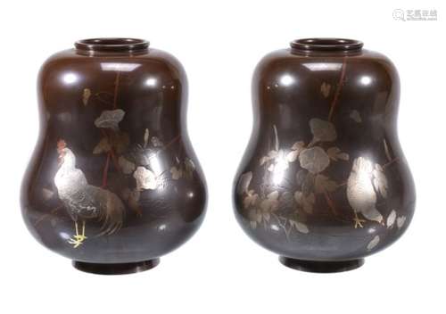 A Pair of Japanese Vases each of squat double-gourd form resting on a short splayed foot and with a