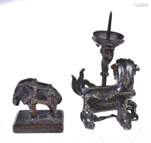 A bronze ‘Shishi’ candlestick