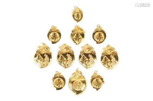 ELEVEN CHINESE GOLD PEACH PENDANTS