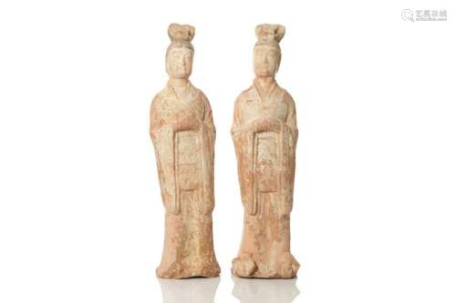 PAIR OF TANG DYNASTY RED POTTERY STANDING FIGURES
