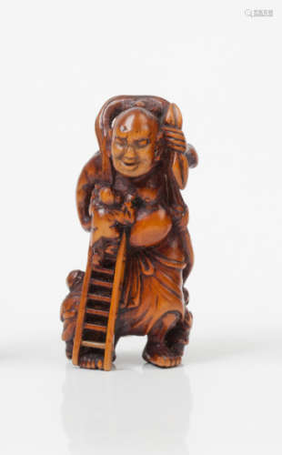 Netsuke en bois représentant une grande sculpture …