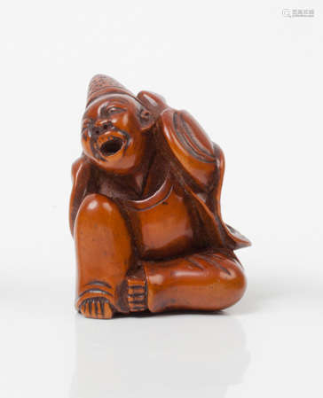 Netsuke en bois représentant un aveugle assis, coi…