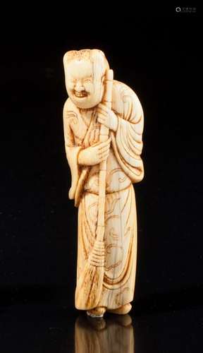 Grand netsuke en ivoire rehaussé de brun, représen…