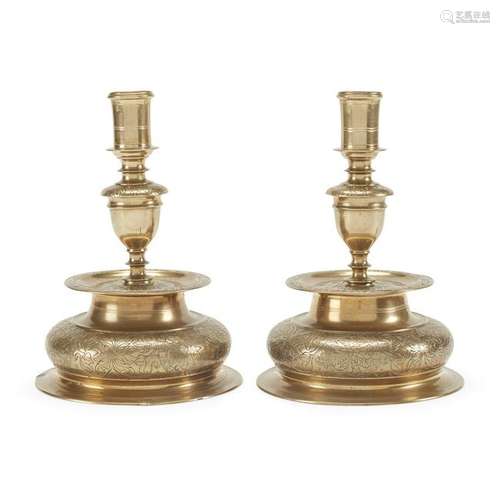 Pair of Nuremberg engraved brass candlesticks, German,