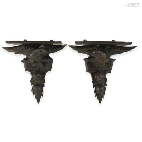 Pair of carved oak wall brackets in the form of eagles