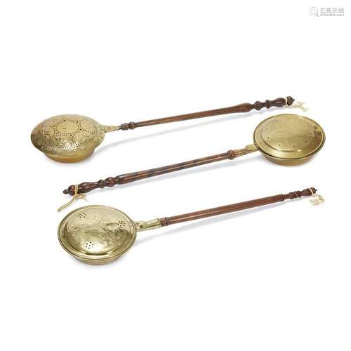 Group of three pierced and decorated brass and turned