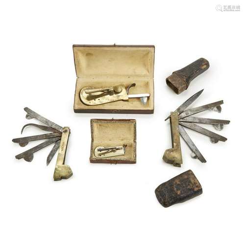 Group of four brass fleams or blood-letting implements,