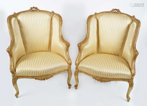 PAIR OF GILT FRAMED WING BACKED ARMCHAIRS