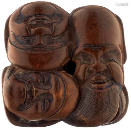 Netsuke MaskengruppeJapan 19. Jh. Helles Holz. Die Masken der sieben Glücksgötter. Signiert.