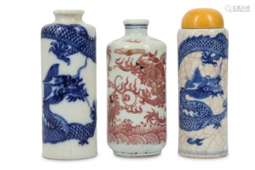 TWO CHINESE BLUE AND WHITE AND ONE UNDERGLAZE RED 'DRAGON' SNUFF BOTTLE.