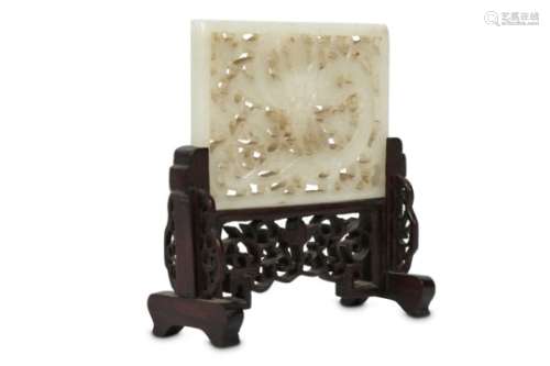 A CHINESE PALE CELADON JADE RETICULATED 'DRAGON' PLAQUE.
