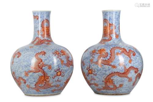 A PAIR OF CHINESE IRON-RED AND BLUE AND WHITE ‘DRAGON’ VASES, TIANQIUPING.