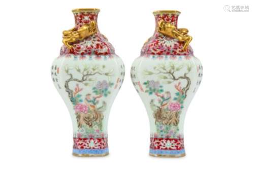A PAIR OF CHINESE FAMILLE ROSE BALUSTER VASES.
