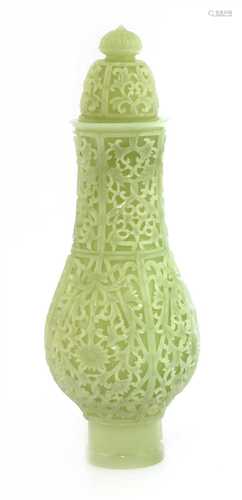 A Chinese jade vase and cover,