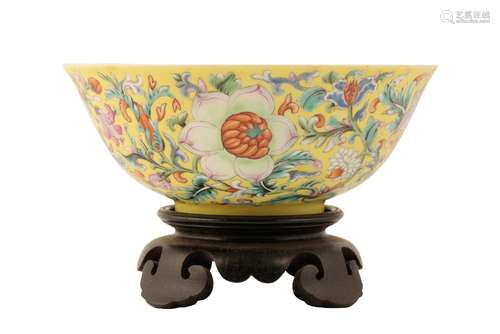 FINE AND RARE FAMILLE ROSE YELLOW-GROUND BOWL, QIANLONG SEAL MARK AND OF THE PERIOD