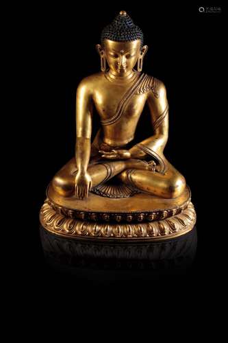 FINE GILT-BRONZE FIGURE OF BUDDHA SHAKYAMUNI, TIBET, 15TH CENTURY