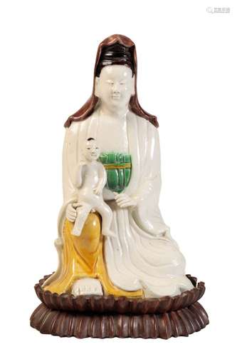 SANCAI GLAZE SEATED FIGURE OF GUANYIN AND CHILD, KANGXI PERIOD