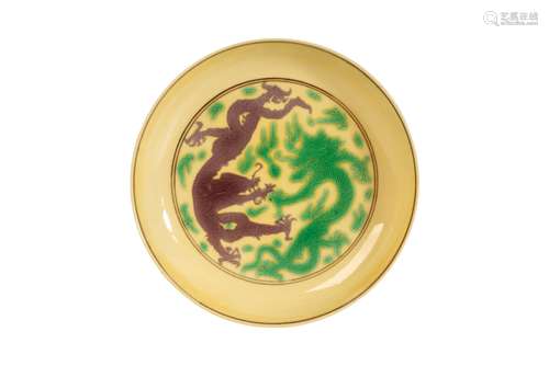 SMALL GREEN AND AUBERGINE DECORATED YELLOW-GROUND DISH, KANGXI SIX CHARACTER MARK AND OF THE PERIOD