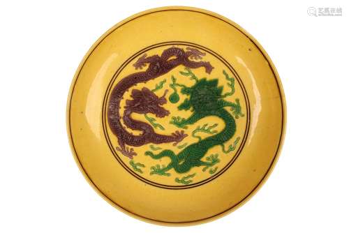 YELLOW-GROUND GREEN AND AUBERGINE 'DRAGON' DISH, ZHENGDE FOUR CHARACTER MARK BUT KANGXI PERIOD