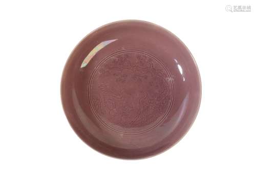 RARE AUBERGINE-GLAZE CARVED 'STORKS AND PINE TREE' DISH, YONGZHENG SIX CHARACTER MARK