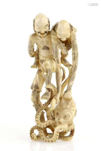 A stained ivory okimono of Ashinaga and Tenaga with an octopus, 11.5 cm high, Meiji